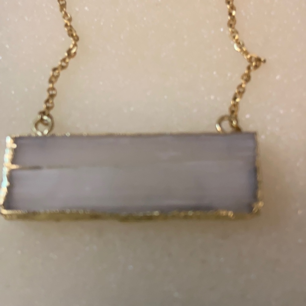 Quartz necklace it comes in a box all ready for a give